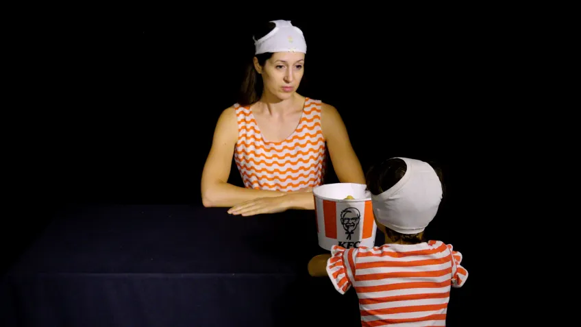 Woman and child with pants on their heads. Photo.